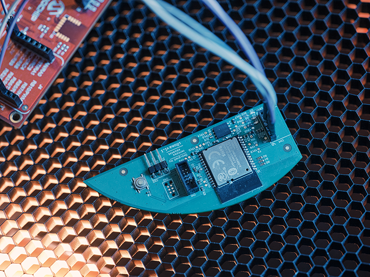 A custom-shape printed circuit board built as a prototype.