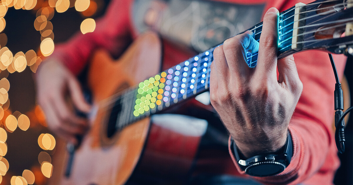 A full spectrum LED learning system attaches to the neck of the guitar, turning it into a display and showing exactly where to put your fingers.