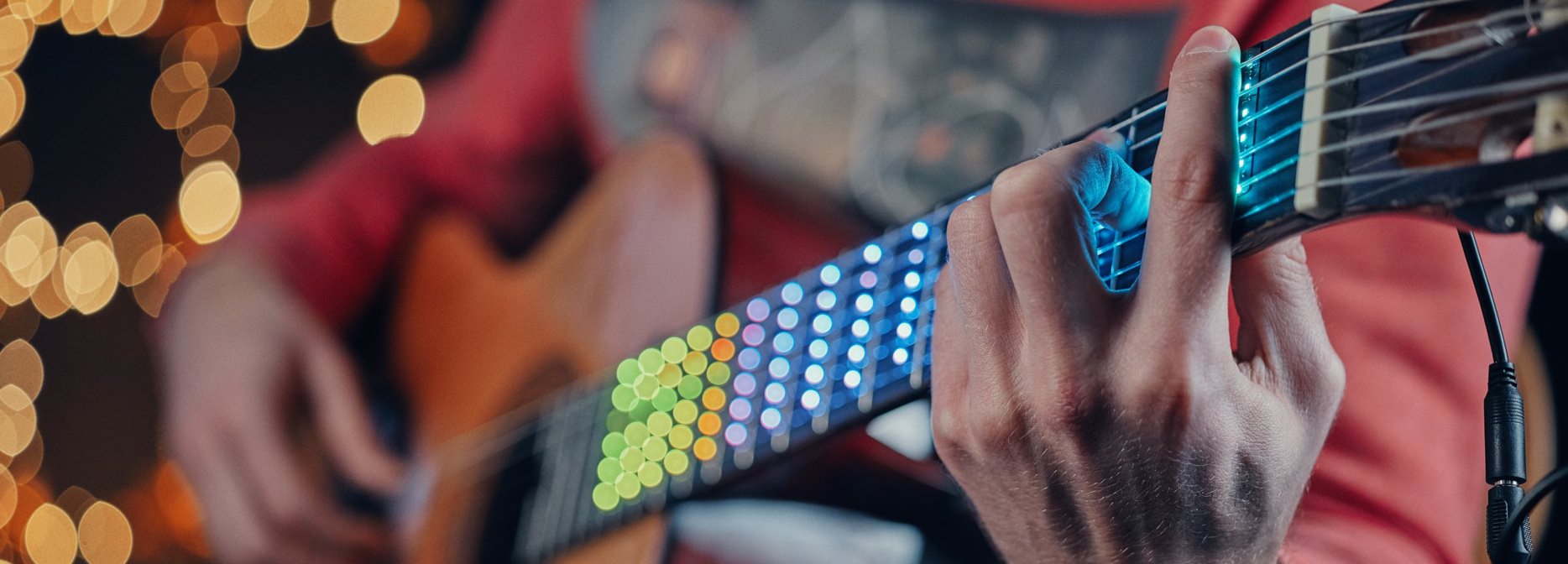 A full spectrum LED learning system attaches to the neck of the guitar, turning it into a display and showing exactly where to put your fingers.