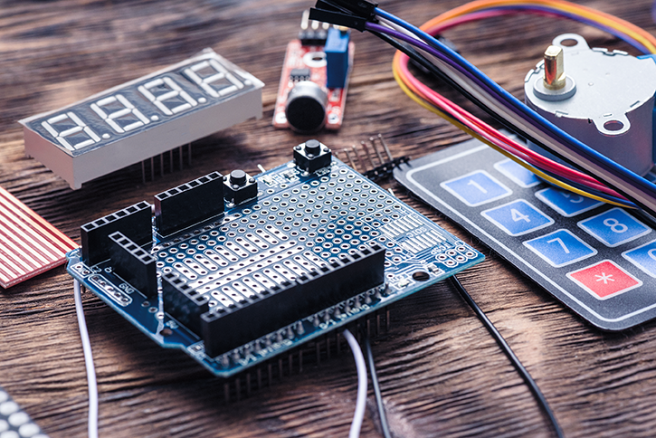 An electronics prototyping board used for designing a PCBA.