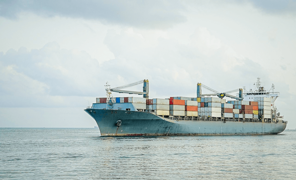 A cargo ship moving in the ocean.