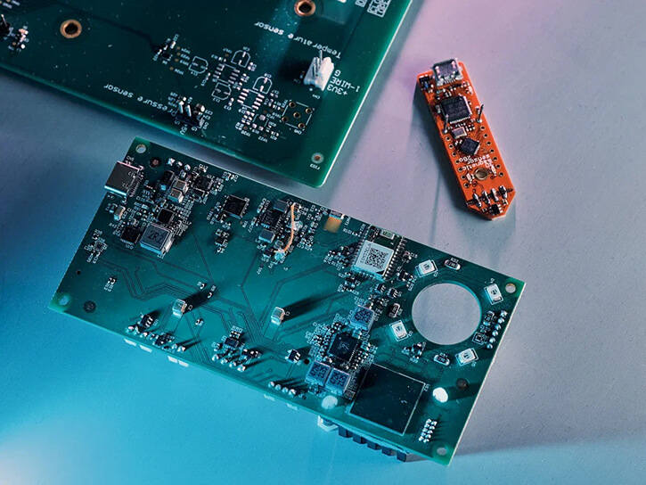 Three printed circuit boards on a table