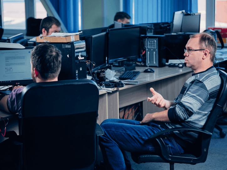 Four men in an IT office