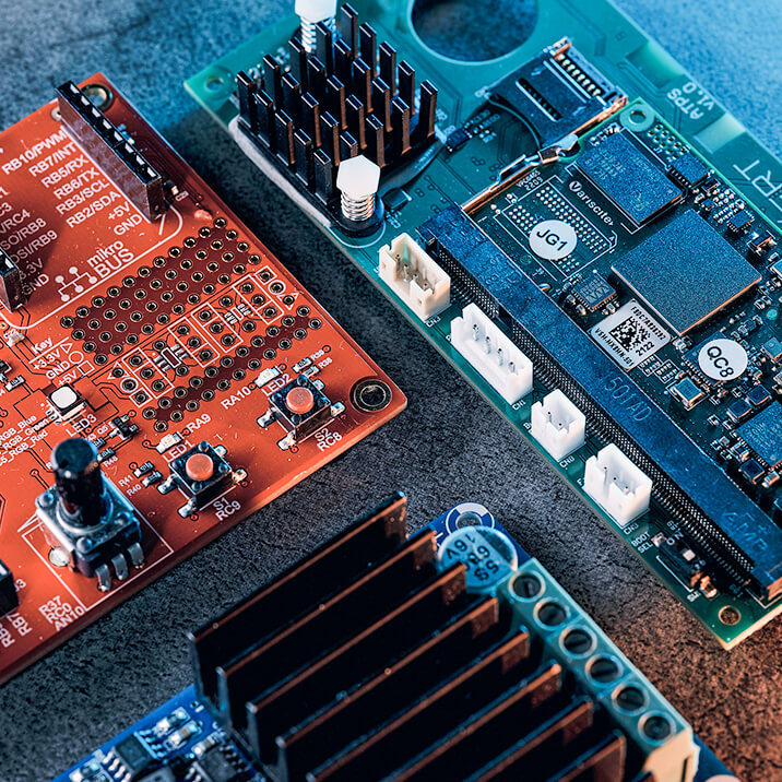 A printed circuit board connected to wires. 