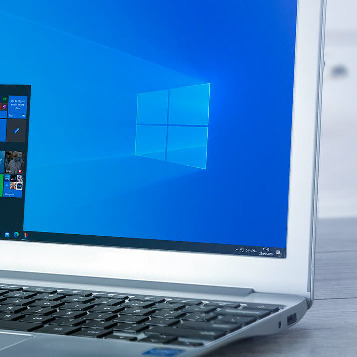 A laptop with Windows OS lying on a desk. 